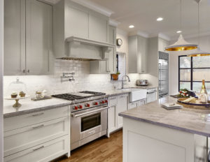 Kitchen with Custom Vent Hood and Pendant Lighting in Highland Park Dallas